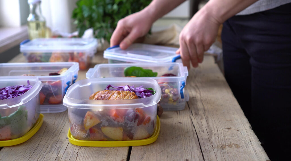 healthy lunch meal prep, multiple food containers on table 