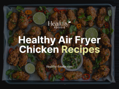 healthy air fryer chicken recipes image with fried chicken on sheet pan with limes, cilantro, peppers
