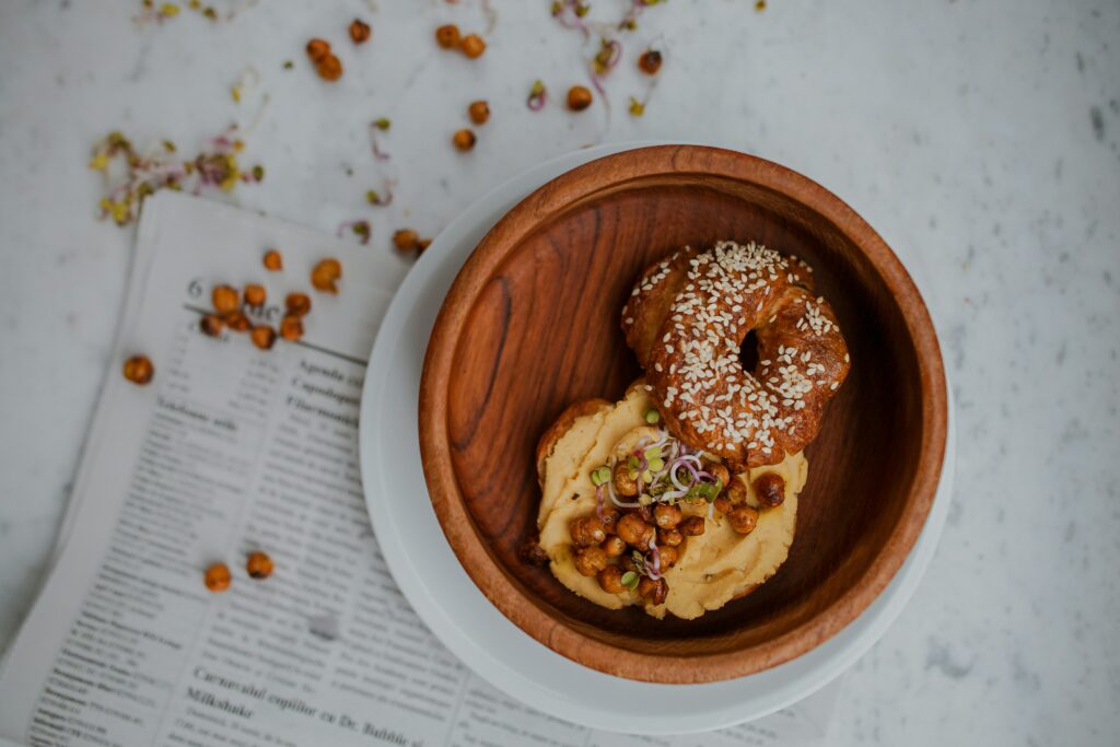 photo of bagel with hummus and roasted chickpeas