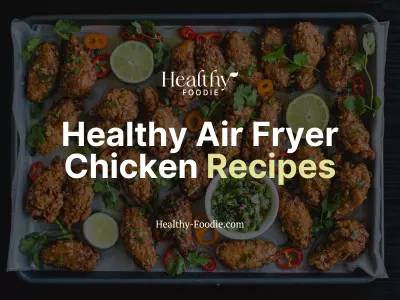 healthy air fryer chicken recipes image with fried chicken on sheet pan with limes, cilantro, peppers
