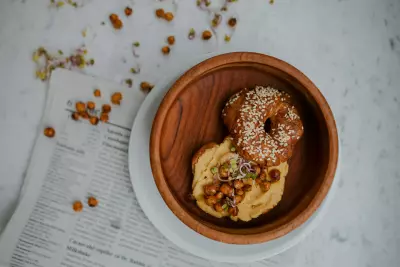 photo of bagel with hummus and roasted chickpeas